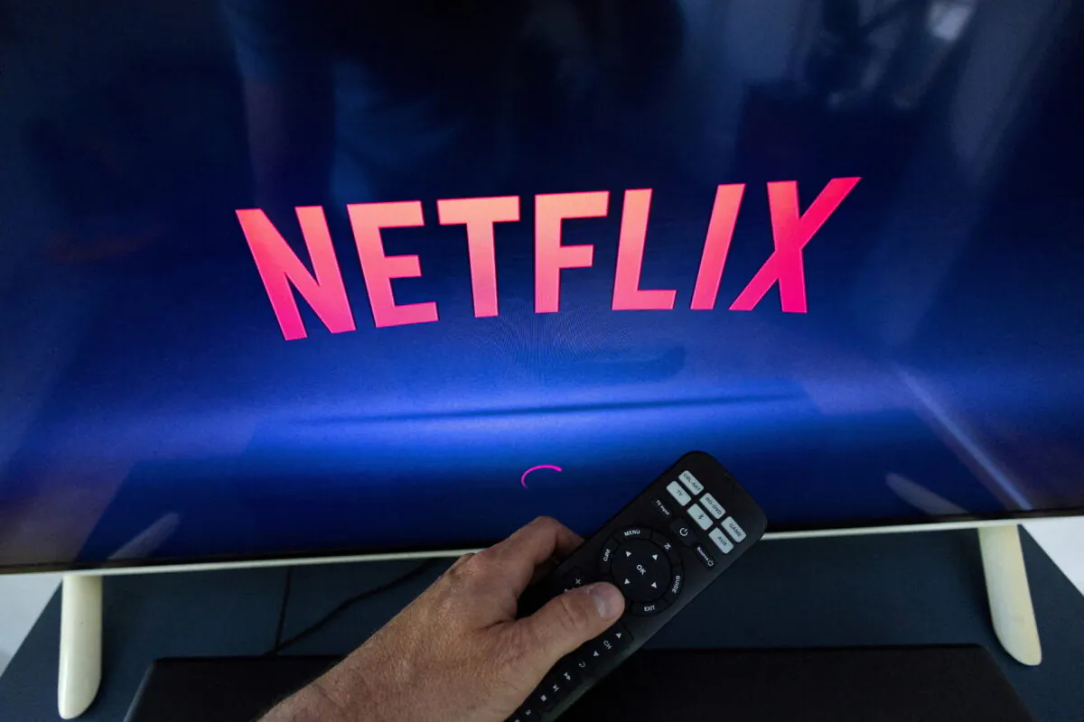 A Netflix logo on a TV screen, ahead of a Swiss vote on a referendum called "Lex Netflix", in a photo illustration taken on May 9, 2022. (Denis Balibouse/Reuters)