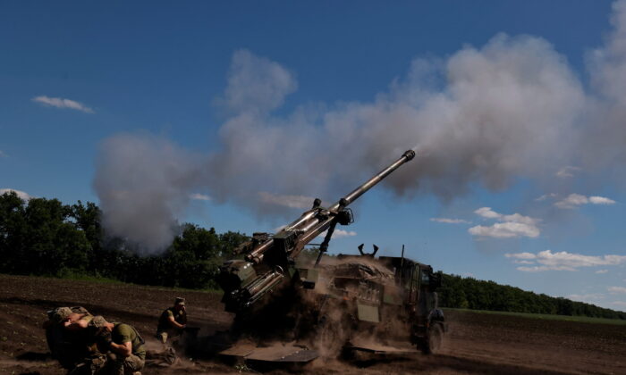Ukrainian service members fire toward Russian positions with a CAESAR self-propelled howitzer as Russia's attack continues in Donetsk Region, Ukraine, on June 8, 2022. (Stringer/Reuters)