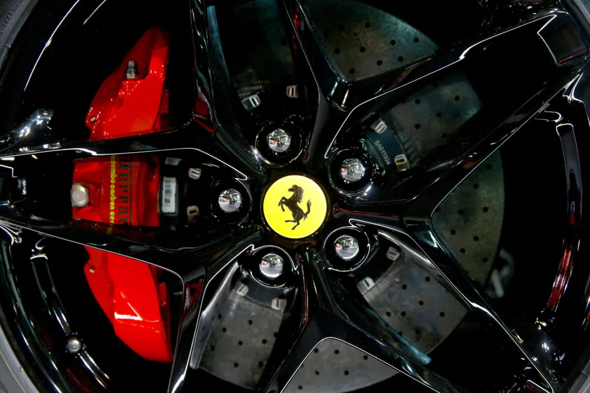 The company's logo on a wheel hub of a Ferrari SF90 Stradale hybrid sports car during a media preview at the Auto Zurich Car Show in Zurich, on Nov. 3, 2021. (Arnd Wiegmann/Reuters)