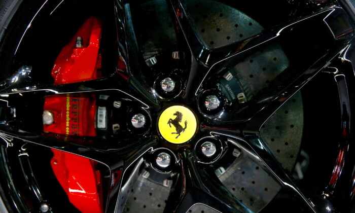 The company's logo on a wheel hub of a Ferrari SF90 Stradale hybrid sports car during a media preview at the Auto Zurich Car Show in Zurich, on Nov. 3, 2021. (Arnd Wiegmann/Reuters)