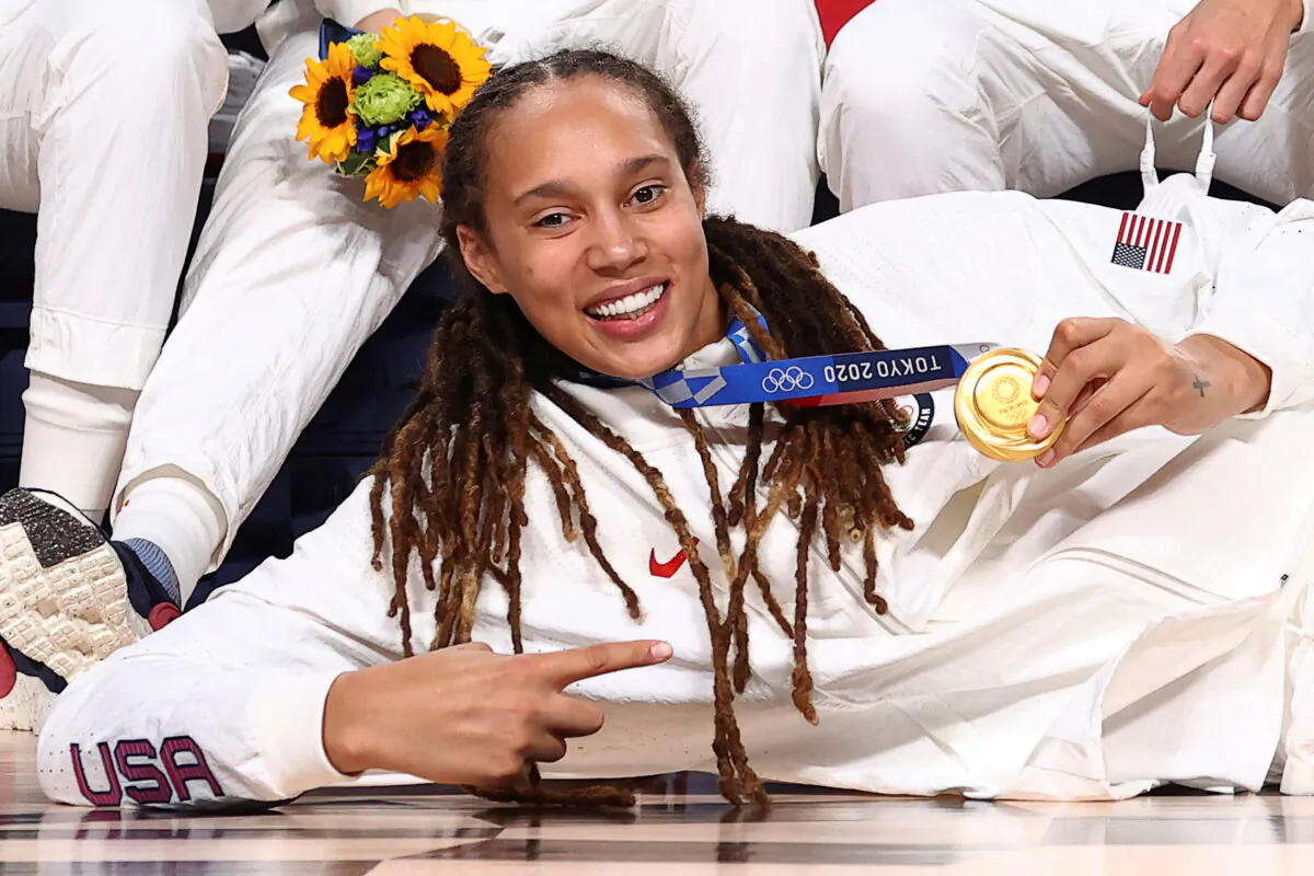 Brittney Griner of the United States poses for a photograph with her gold medal in Women's Basketball at the Tokyo 2020 Summer Olympics at the Saitama Super Arena in Saitama, Japan, on Aug. 8, 2021. (Brian Snyder/Reuters)