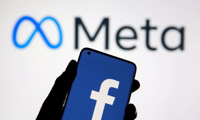 A smartphone with Facebook's logo is seen in front of displayed Facebook's new rebrand logo Meta in this illustration taken Oct. 28, 2021. (Dado Ruvic/Illustration/Reuters)