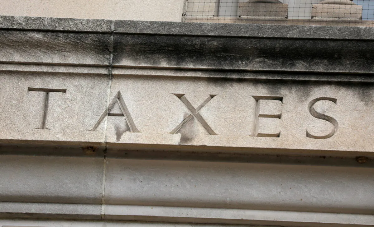 The word "taxes" is seen engraved at the headquarters of the IRS in Washington on May 10, 2021. (Andrew Kelly/Reuters)