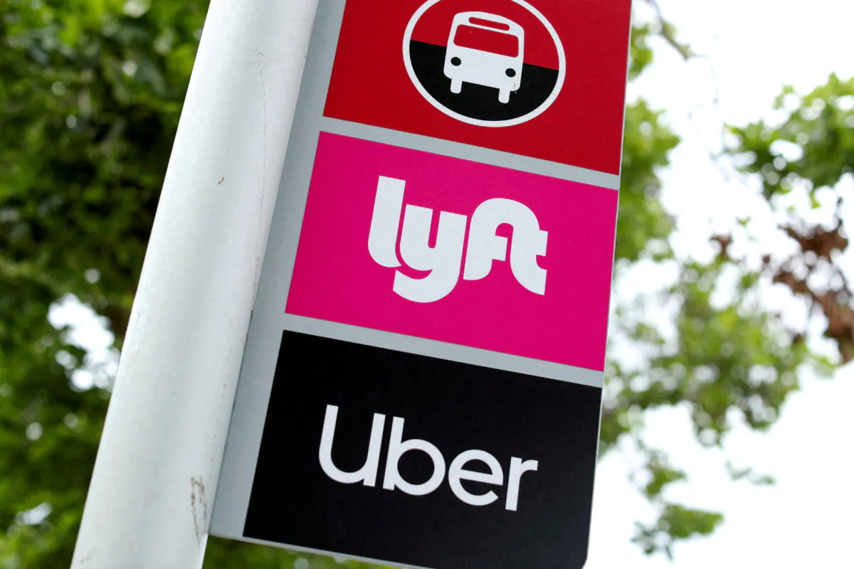 A sign marks a rendezvous location for Lyft and Uber users at San Diego State University in San Diego, Calif., May 13, 2020. (Mike Blake/Reuters, File Photo)