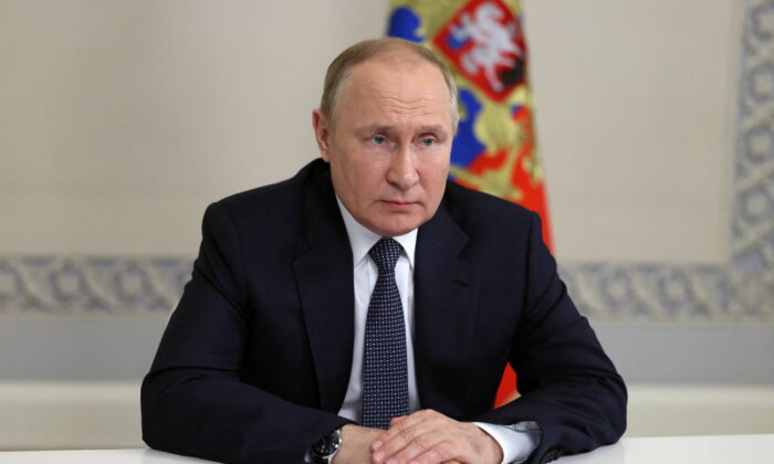 Russian President Vladimir Putin chairs a meeting with members of the Security Council via video link in Moscow on June 22, 2022. (Sputnik/Mikhail Metzel/Kremlin via Reuters)
