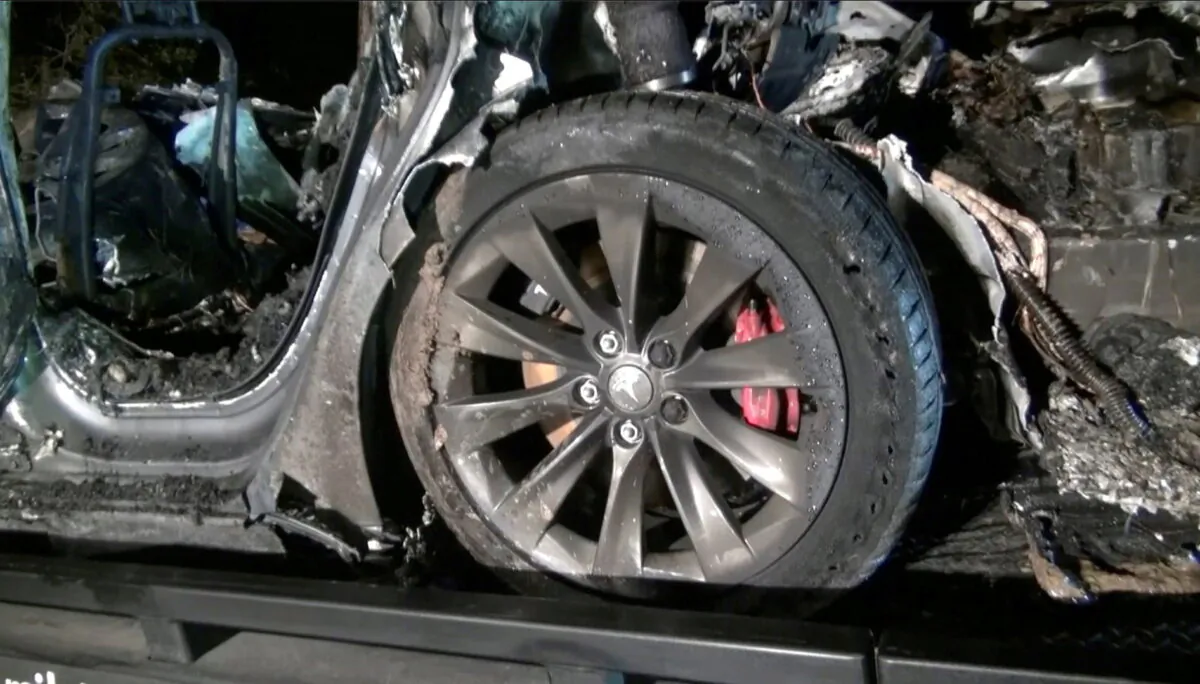 The remains of a Tesla vehicle after it crashed in The Woodlands, Texas in this still image from video obtained via social media on April 17, 2021. (Scott J. Engle via Reuters/Reuters)