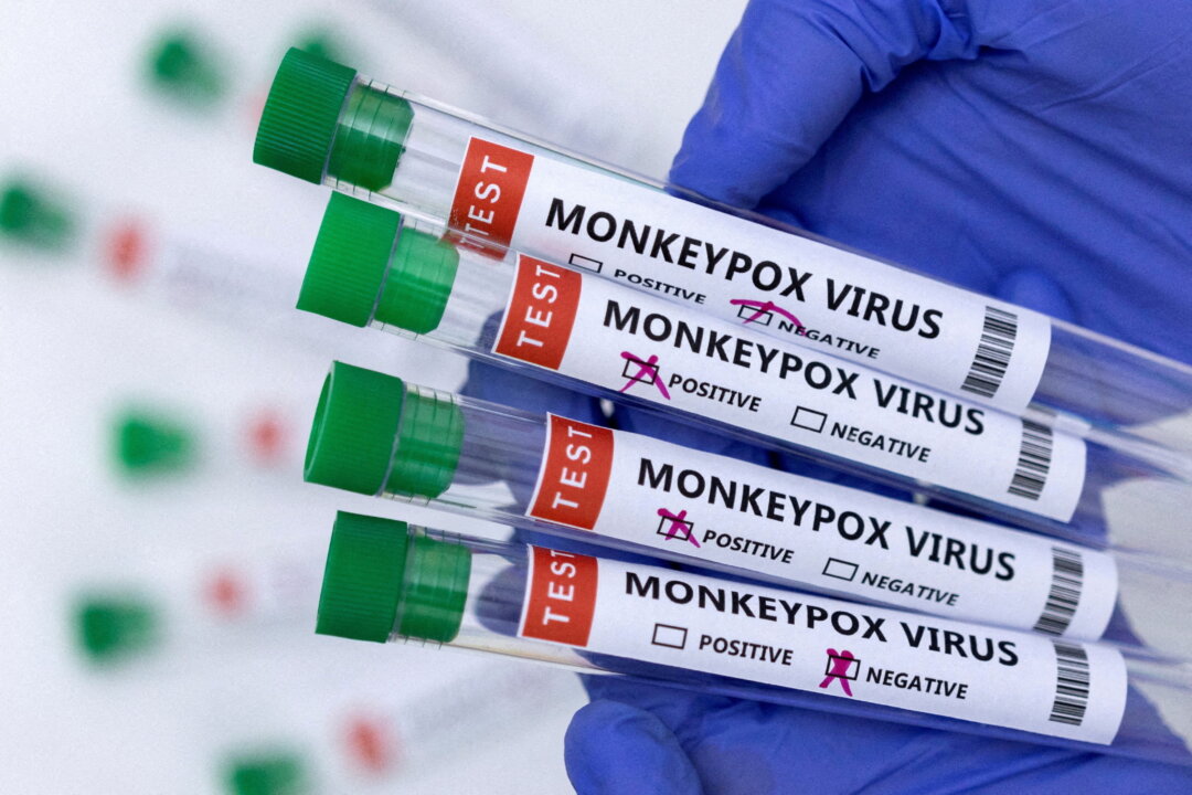 Test tubes labeled "Monkeypox virus positive and negative" are seen in this illustration taken on May 23, 2022. (Dado Ruvic/Reuters)