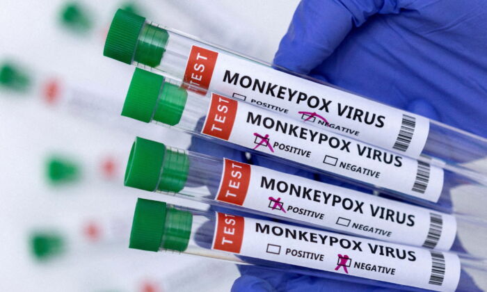 Test tubes labeled "Monkeypox virus positive and negative" are seen in this illustration taken on May 23, 2022. (Dado Ruvic/Reuters)