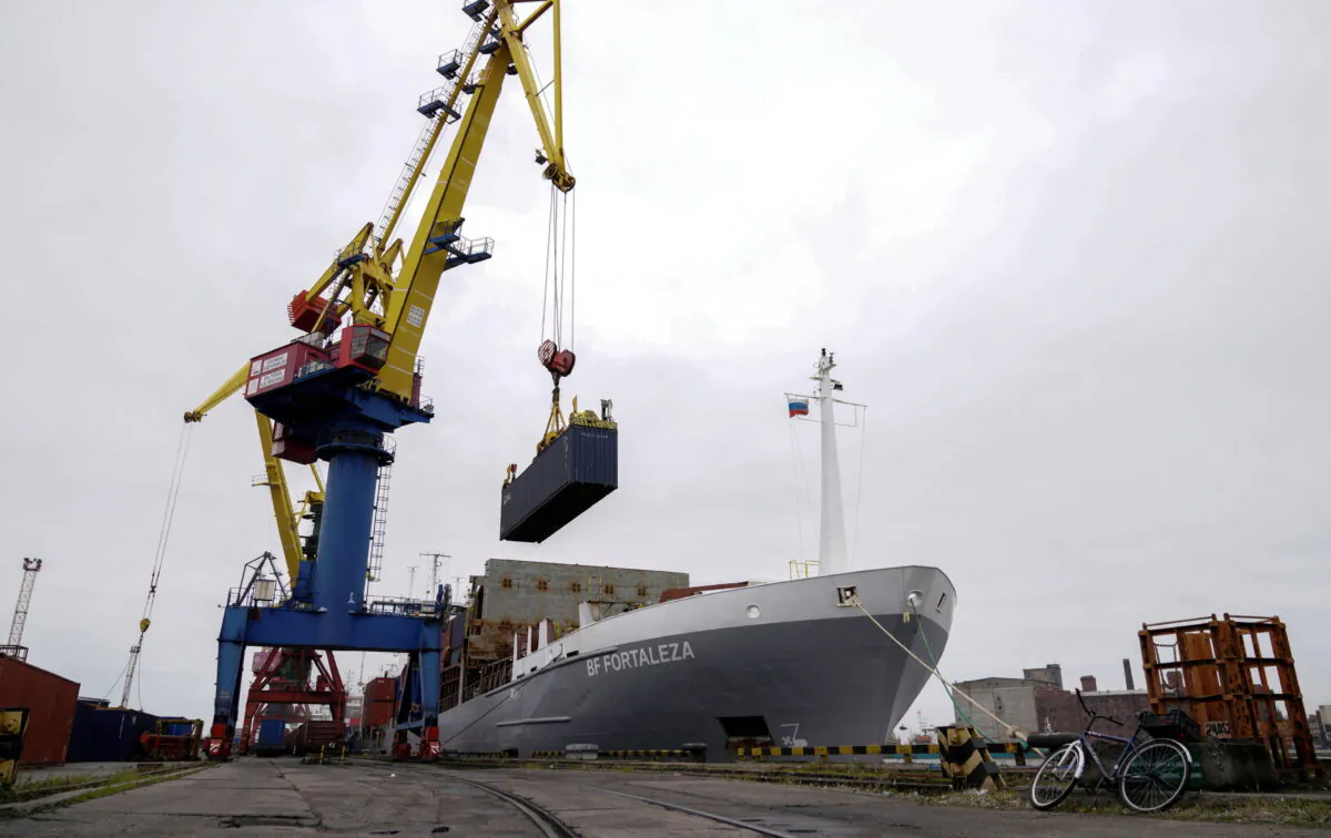 A crane lifts a shipping container at a commercial port in Kaliningrad, Russia, on Oct. 28, 2021. (Vitaly Nevar/Reuters)