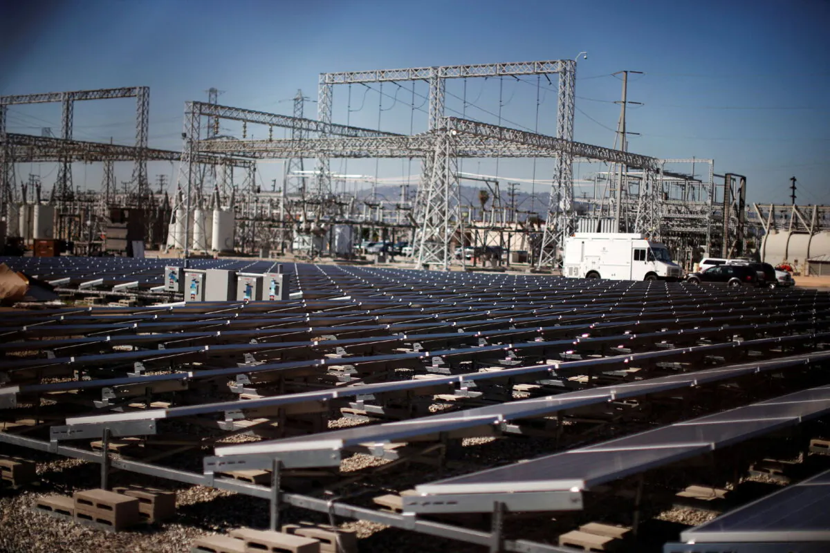 Solar panels are seen next to a Southern California Edison electricity station in Carson, Calif., on March 4, 2015. (Lucy Nicholson/Reuters)