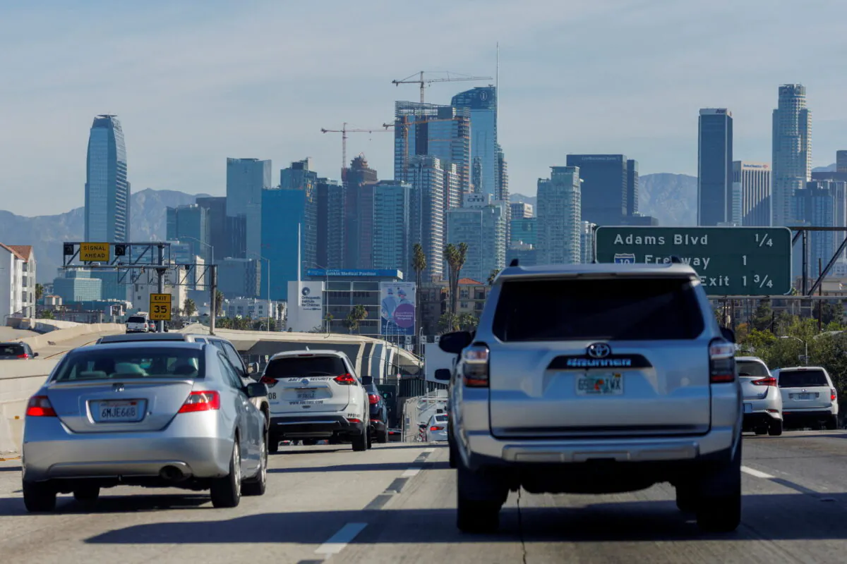 Traffic moves along a freeway in a file photo. REUTERS/Mike Blake/File Photo