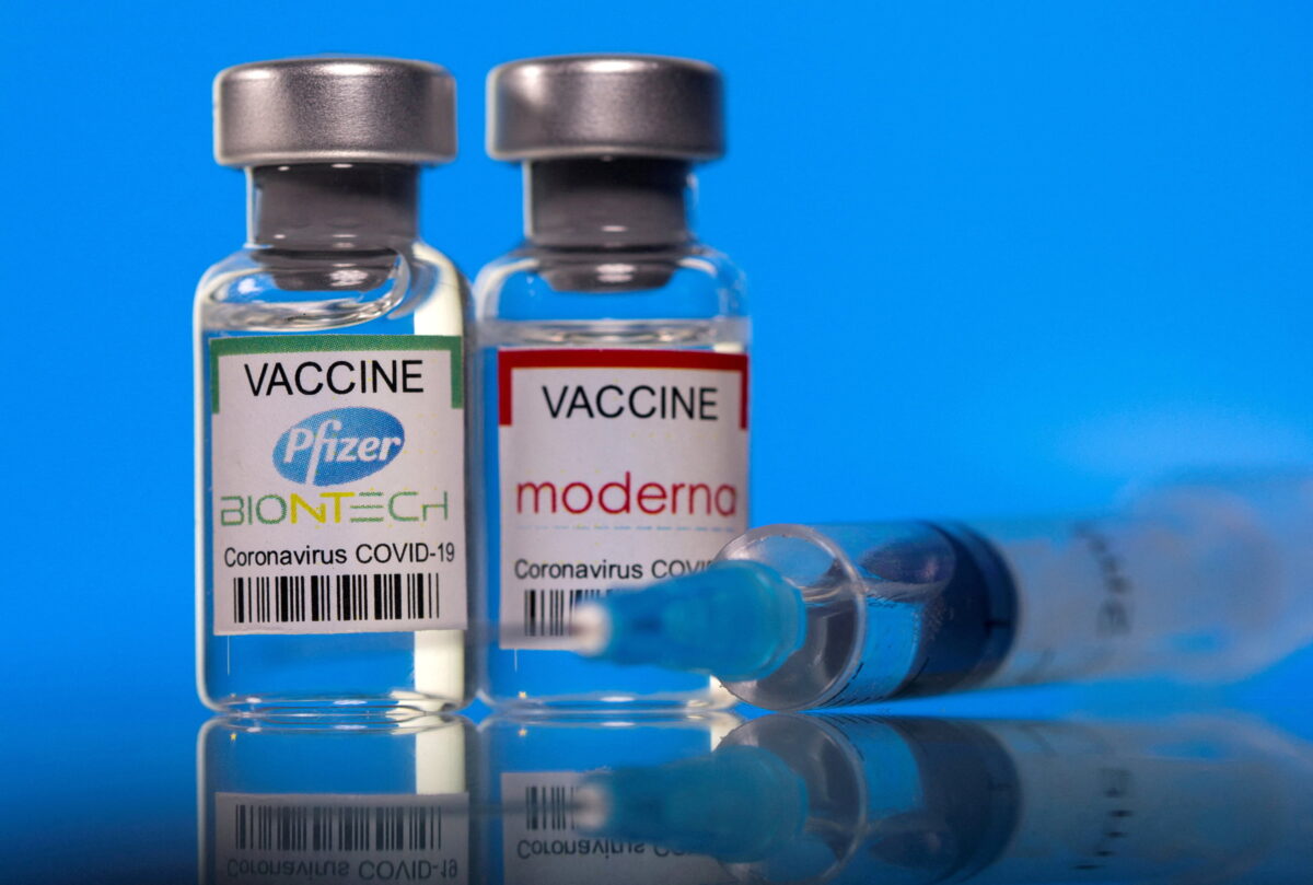 Vials with Pfizer-BioNTech and Moderna coronavirus disease (COVID-19) vaccine labels are seen in this illustration picture taken March 19, 2021. (Dado Ruvic/Illustration/File Photo/Reuters)
