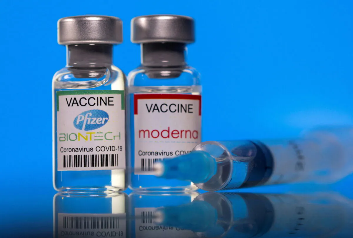 Vials with Pfizer-BioNTech and Moderna coronavirus disease (COVID-19) vaccine labels are seen in this illustration picture taken March 19, 2021. (Dado Ruvic//Reuters)