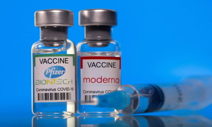 Vials with Pfizer-BioNTech and Moderna coronavirus disease (COVID-19) vaccine labels are seen in this illustration picture taken March 19, 2021. (Dado Ruvic/Illustration/File Photo/Reuters)
