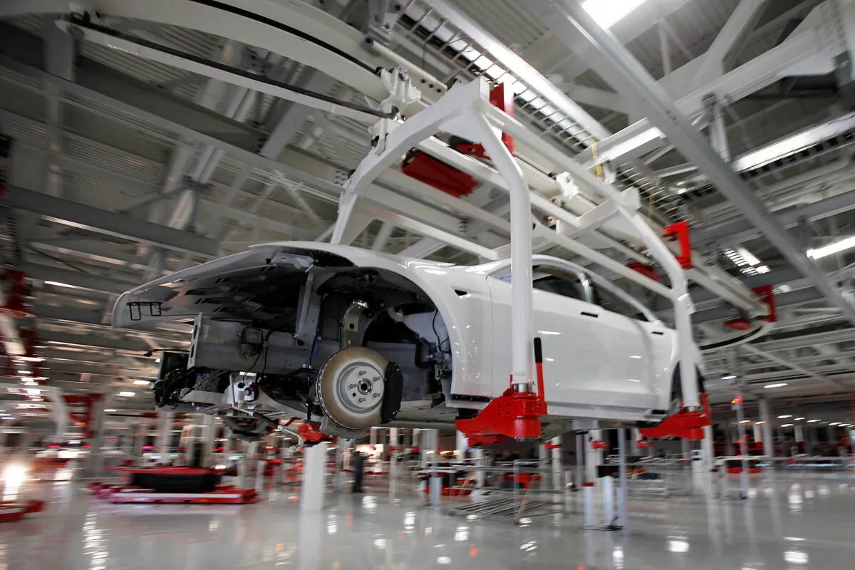 The body of a Tesla Model S is transported by an automated crane at the Tesla factory in Fremont, Calif., on Oct. 1, 2011. (Stephen Lam/Reuters)