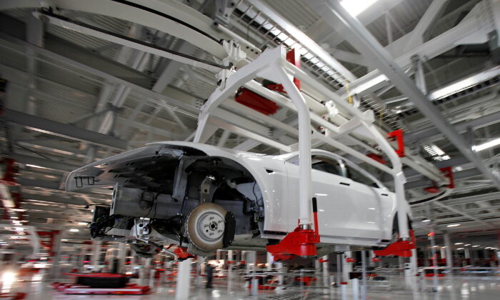 The body of a Tesla Model S is transported by an automated crane at the Tesla factory in Fremont, Calif., on Oct. 1, 2011. (Reuters/Stephen Lam/File Photo
