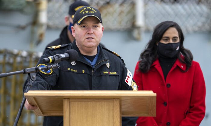 Cmdr. Dale St. Croix, commanding officer of HMCS Halifax delivers remarks as Defence Minister Anita Anand, right, look on as the frigate prepares to depart Halifax in support of NATO's deterrence measures in eastern Europe on March 19, 2022. (The Canadian Press/Andrew Vaughan)
