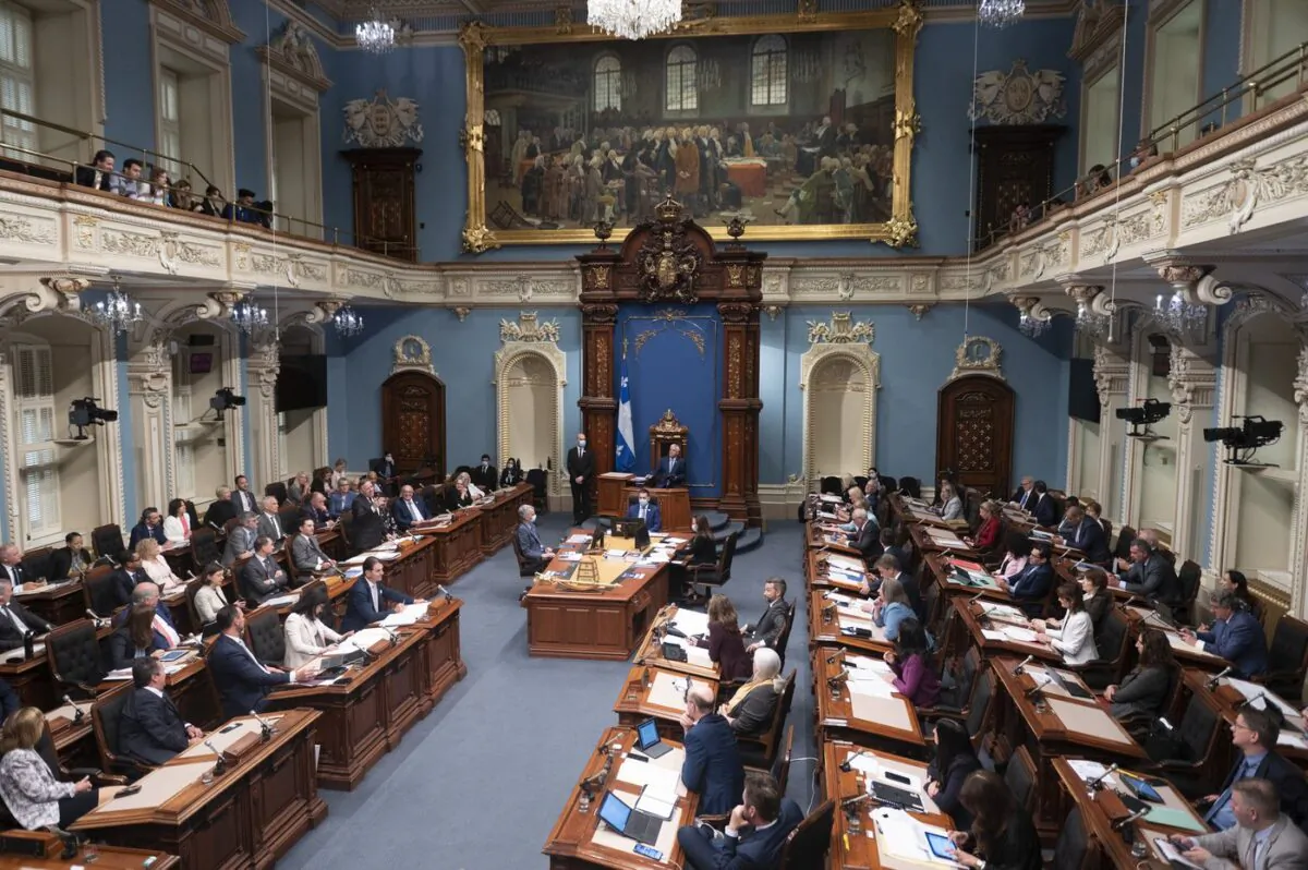 Quebec Premier François Legault, left, responds to the Opposition during question period, June 8, 2022, at the legislature in Quebec City. (The Canadian Press/Jacques Boissinot)