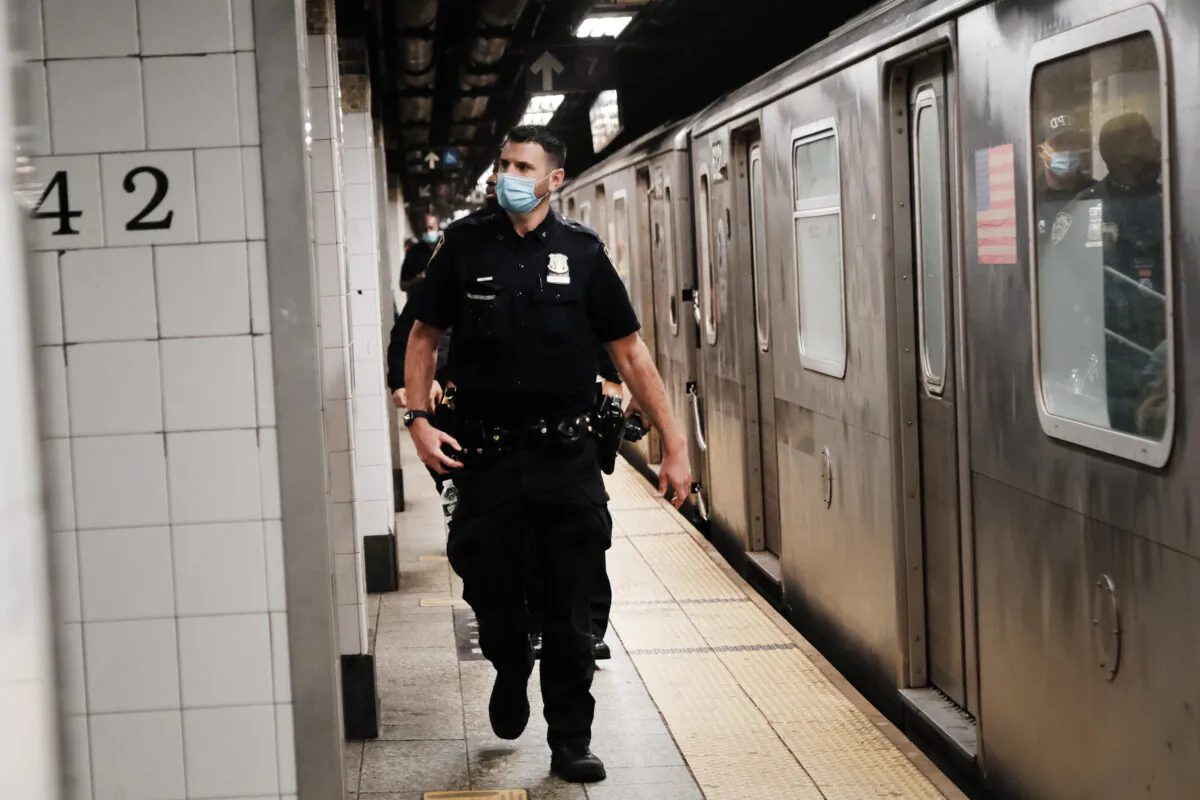 Police search for a suspect at a subway station in New York on April 25, 2022. (Spencer Platt/Getty Images)
