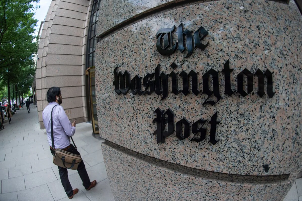 A man walks into the Washington Post building in Washington on May 16, 2019. (Eric Baradat/AFP via Getty Images)