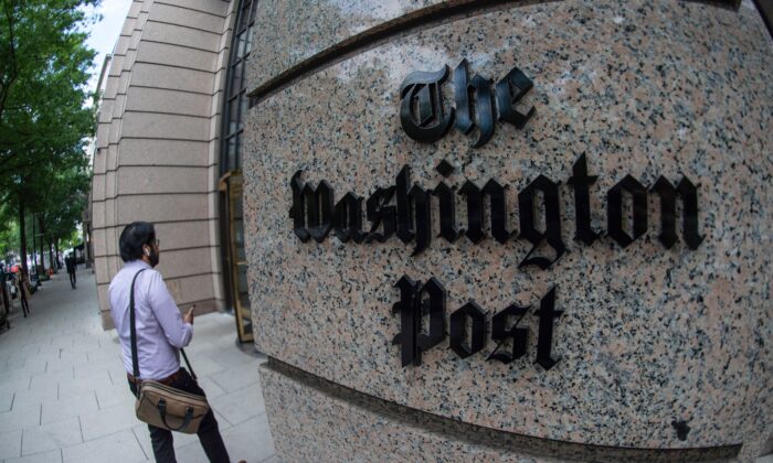 A man walks into the Washington Post building in Washington on May 16, 2019. (Eric Baradat/AFP via Getty Images)