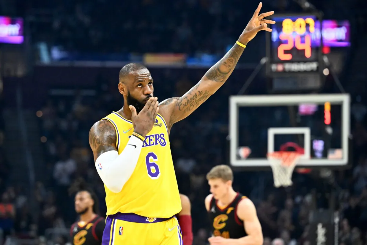LeBron James #6 of the Los Angeles Lakers waves to the crowd during the first quarter against the Cleveland Cavaliers at Rocket Mortgage Fieldhouse in Cleveland, Ohio on March 21, 2022. (Jason Miller/Getty Images)