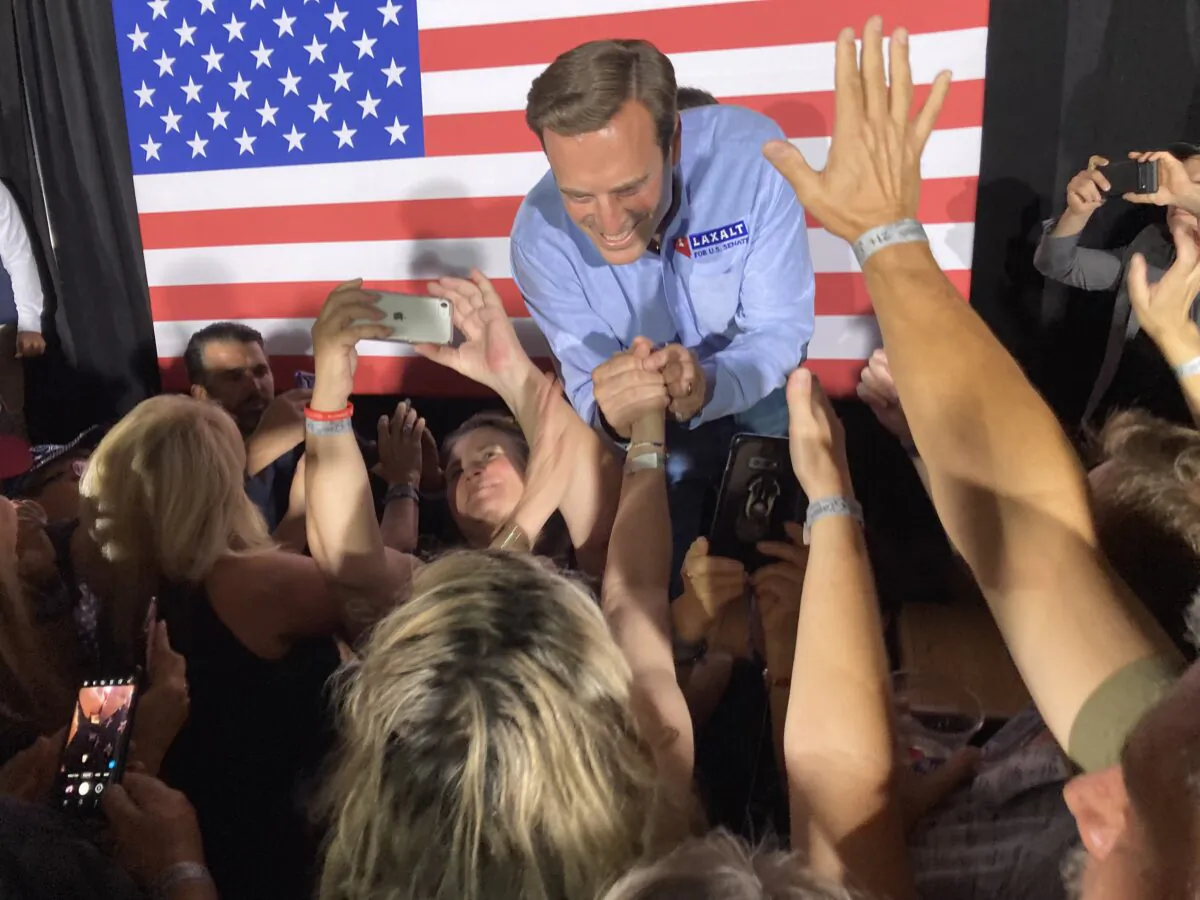 Nevada Republican US Senate candidate Adam Laxalt shakes hands with supporters during a rally Friday at Stoney's Rockin' Country in Las Vegas. The Nevada primary elections are June 14. (The Epoch Times photo by John Haughey)