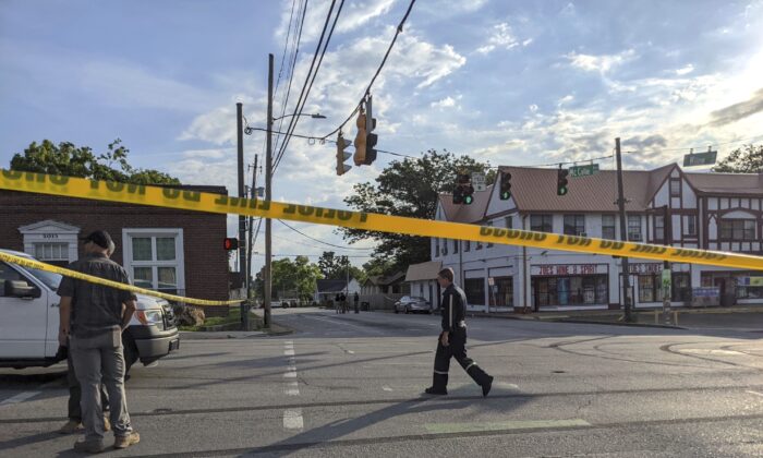 The Chattanooga Police Department investigate the scene following a shooting in Chattanooga, Tenn.,  on June 5, 2022. (Tierra Hayes/Chattanooga Times Free Press via AP)