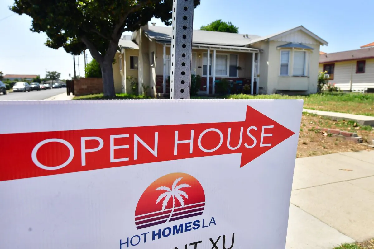 A sign points toward an Open House in Alhambra, California, on May 4, 2022. The Fed announced its biggest interest rate hike in over twenty years as it deals with fast-rising prices in the U.S. economy. (Frederic J. Brown/AFP via Getty Images)