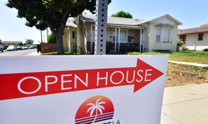 A sign points toward an Open House in Alhambra, California, on May 4, 2022. The Fed announced its biggest interest rate hike in over twenty years as it deals with fast-rising prices in the U.S. economy. (Frederic J. Brown/AFP via Getty Images)