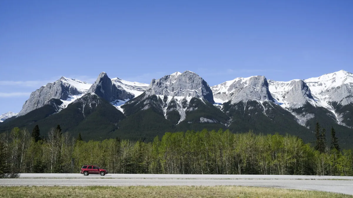 A vehicle on the Trans-Canada Highway passing through Canmore, Alta., in a file photo. (The Canadian Press/Jeff McIntosh)