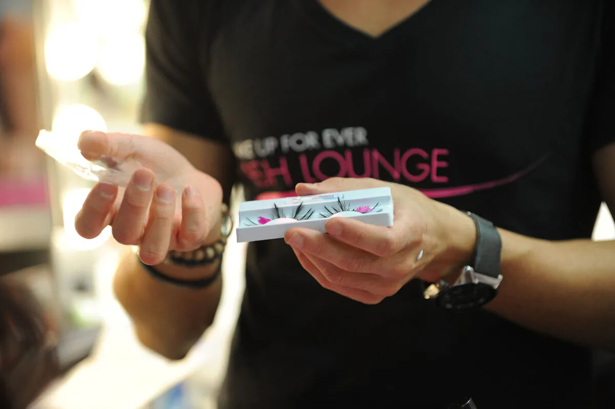 In this file photo, "Lash Tenders" create false eyelashes for guests at the Sephora Soho Fashion's Night Out party in New York City on September 8, 2011. (Simon Russell/Getty Images for Sephora)
