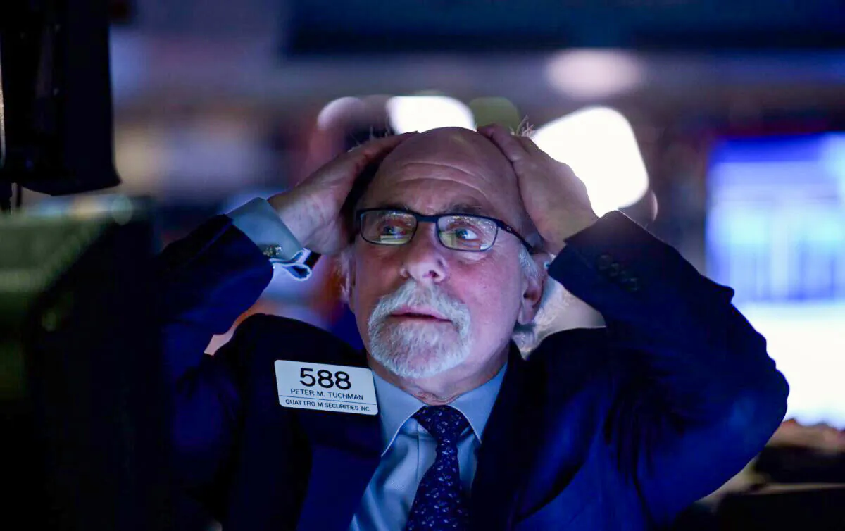Traders work at the New York Stock Exchange (NYSE) at Wall Street in New York on Feb. 24, 2020. (Johannes Eisele/AFP via Getty Images)