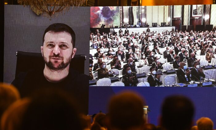 Ukraine's President Volodymyr Zelenskyy addresses participants at the Shangri-La Dialogue summit via a video link in Singapore on June 11, 2022. (Roslan Rahman/AFP via Getty Images)