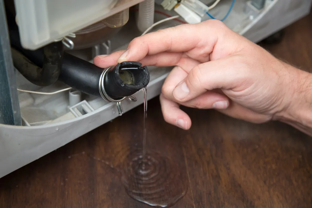 The hose that connects your washing machine to water can rupture and split, causing a leak that damages your home. That is where a safety valve comes in. (urbans/Shutterstock)