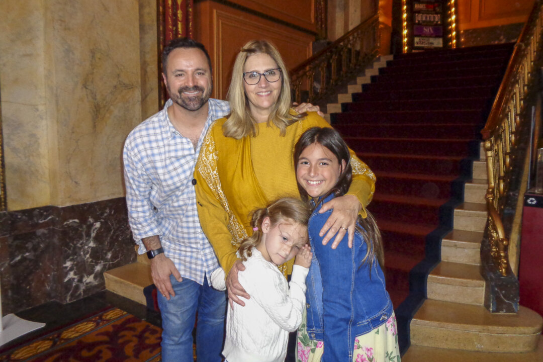 Mary Celani and Scott Celani with their two children at Shea's Buffalo Theatre, in Buffalo, N.Y. on June 10, 2022. (NTD)