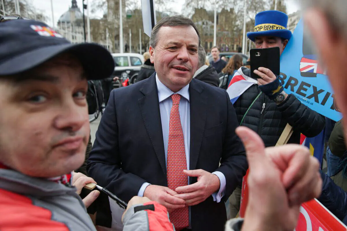 British businessman and co-founder of Leave.EU campaign, Arron Banks interacts with demonstrators near the Houses of Parliament in central London on March 27, 2019. (Daniel Leal/AFP via Getty Images)