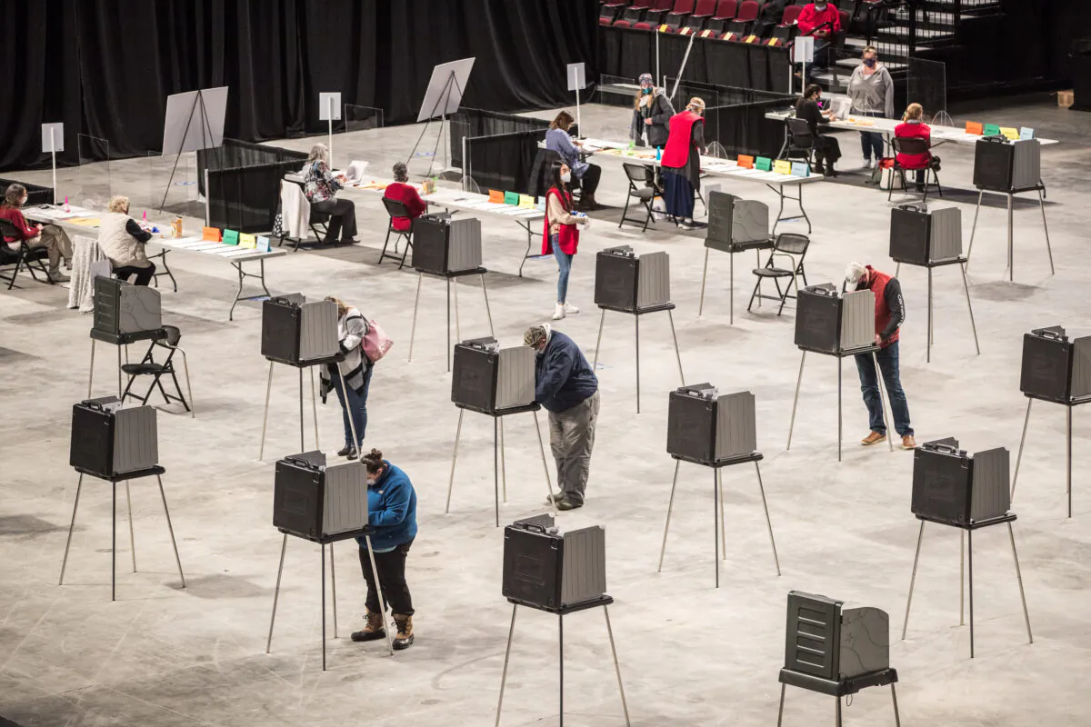 File photo: Voters fill out and cast their ballots at the Cross Insurance Center polling location where the entire city votes on November 3, 2020 in Bangor, Maine. (Scott Eisen/Getty Images)
