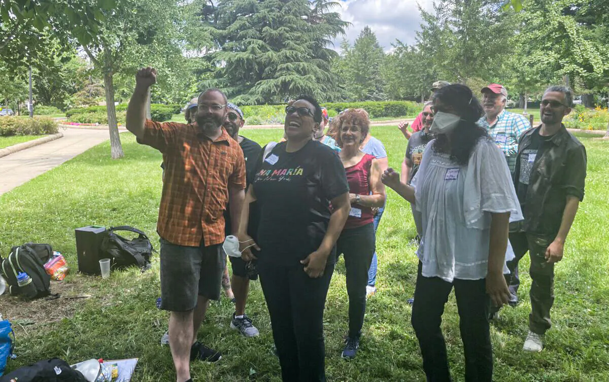 Pro-abortion activists Patrick Young (left), LaDona, (front center), Nadine Bloch (frontmiddle), Sophia M (front right), and others pose for a picture at a protest meeting at Petworth United Methodist Church on June 12, 2022 (Jackson Elliott/The Epoch Times)