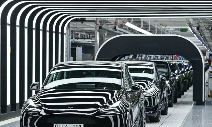 A line of electric vehicles of the Model Y during the start of the production at Tesla's "Gigafactory" in Gruenheide, southeast of Berlin, on March 22, 2022. (Patrick Pleul/Pool/AFP via Getty Images)