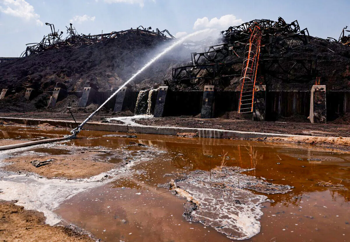 Piles of burnt sunflower seed meal at a destroyed area of the Nika-Tera grain terminal in Mykolaiv, Ukraine, on June 12, 2022. (Edgar Su/Reuters)