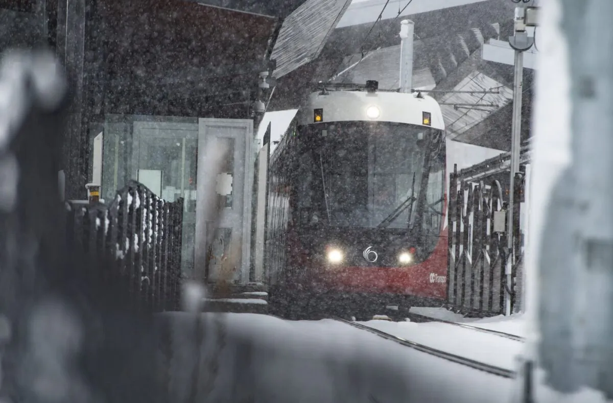 An OC Transpo LRT leaves Bayview Station on the Confederation Line during a snowstorm in Ottawa, Feb. 27, 2020. (The Canadian Press/Justin Tang)