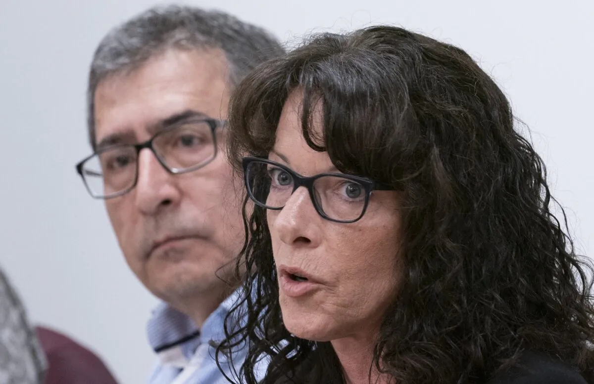 Tracy Wing, mother of Riley Fairholm, responds to a question as Cesur Celik, father of Koray Kevin Celik, looks on during a news conference in Montreal on Sept. 16, 2019. (The Canadian Press/Paul Chiasson)