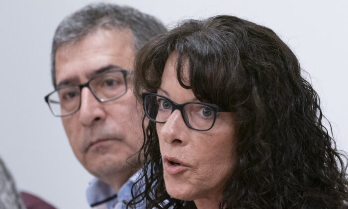 Tracy Wing, mother of Riley Fairholm, responds to a question as Cesur Celik, father of Koray Kevin Celik, looks on during a news conference in Montreal on Sept. 16, 2019. (The Canadian Press/Paul Chiasson)
