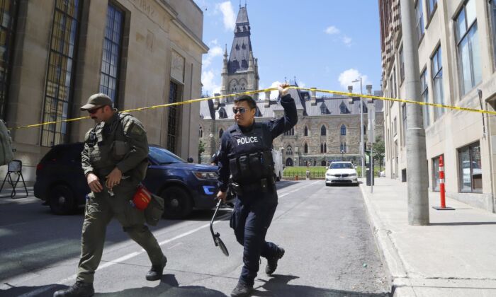 Police respond to an incident on Parliament Hill in Ottawa on June 11, 2022. (The Canadian Press/ Patrick Doyle)
