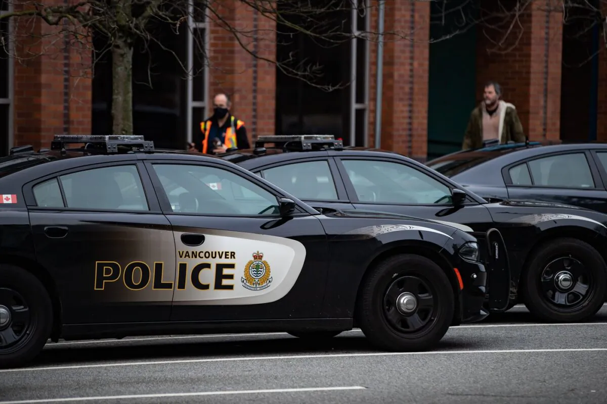Police cars are seen parked outside Vancouver Police Department headquarters in Vancouver, on Jan. 9, 2021. (Darryl Dyck/The Canadian Press)