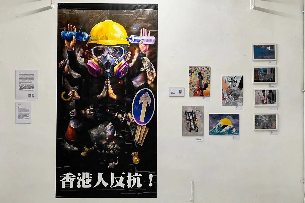 One grand painting "Thousand-handed Man"(千手人), by an artist couple, once displayed in Causeway Bay during the anti-extradition period, is in the exhibition now, albeit with traces of scratched paints when being removed at that time.  (The Epoch Times UK)