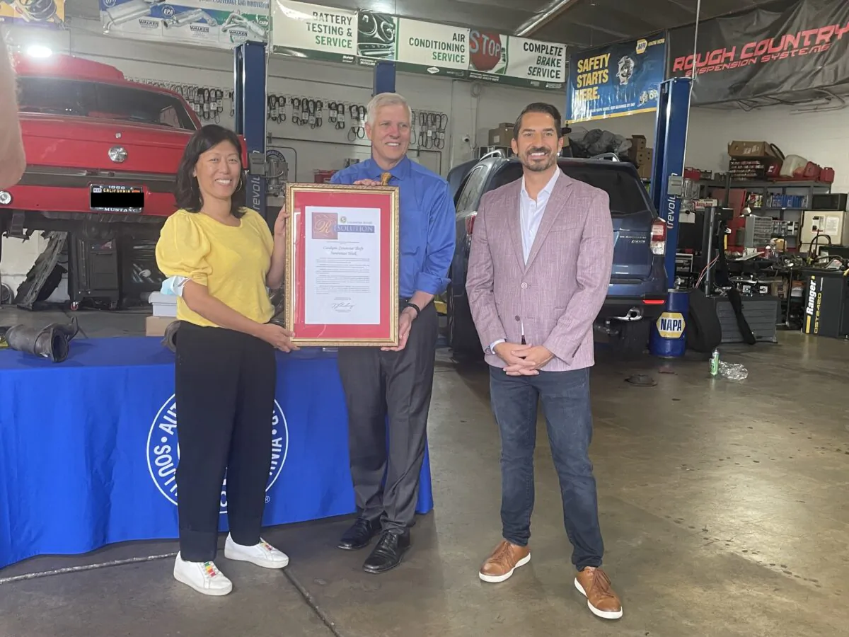 (L–R) Marianne Kim, a California Auto Club representative, Sen. Tom Umberg (D-Santa Ana), and Doug Shupe, a California Auto Club spokesman announce a state Senate resolution designating June 13 as the beginning of Catalytic Converter Awareness Week at Buddy's Auto Tires and More in Garden Grove, Calif., on June 13, 2022. (Carol Cassis/The Epoch Times)