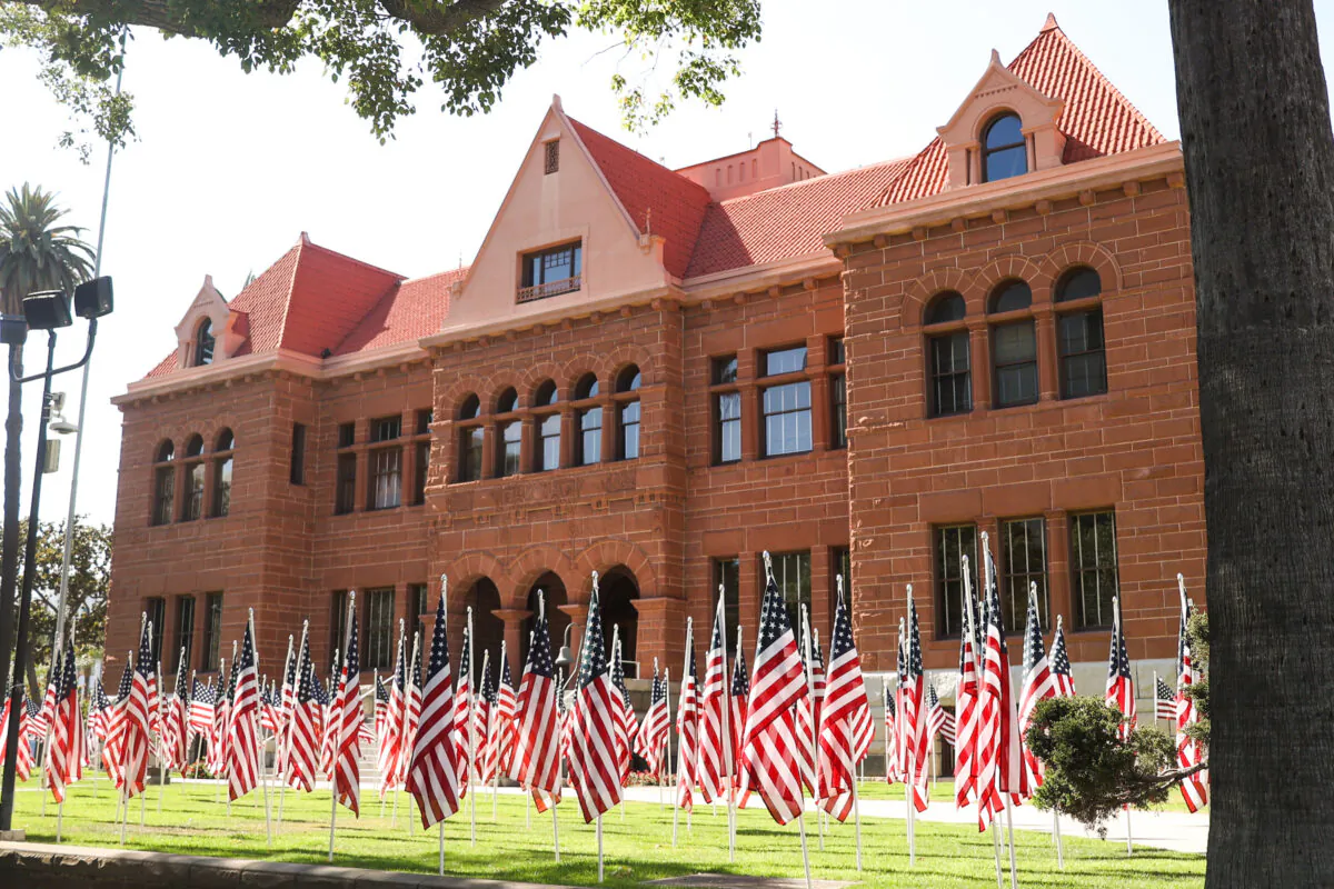 Hundreds of American flags are on display on the front lawn of the Old Orange County Courthouse in Santa Ana, Calif., on June 13, 2022. (Julianne Foster/The Epoch Times) 