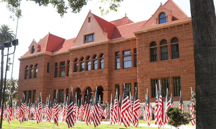 Hundreds of American flags are on display on the front lawn of the Old Orange County Courthouse in Santa Ana, Calif., on June 13, 2022. (Julianne Foster/The Epoch Times) 